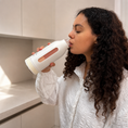 Load image into Gallery viewer, Woman drinking from a white tumbler in a kitchen setting