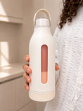 Load image into Gallery viewer, Person holding a white water bottle with a pink accent in a kitchen setting

